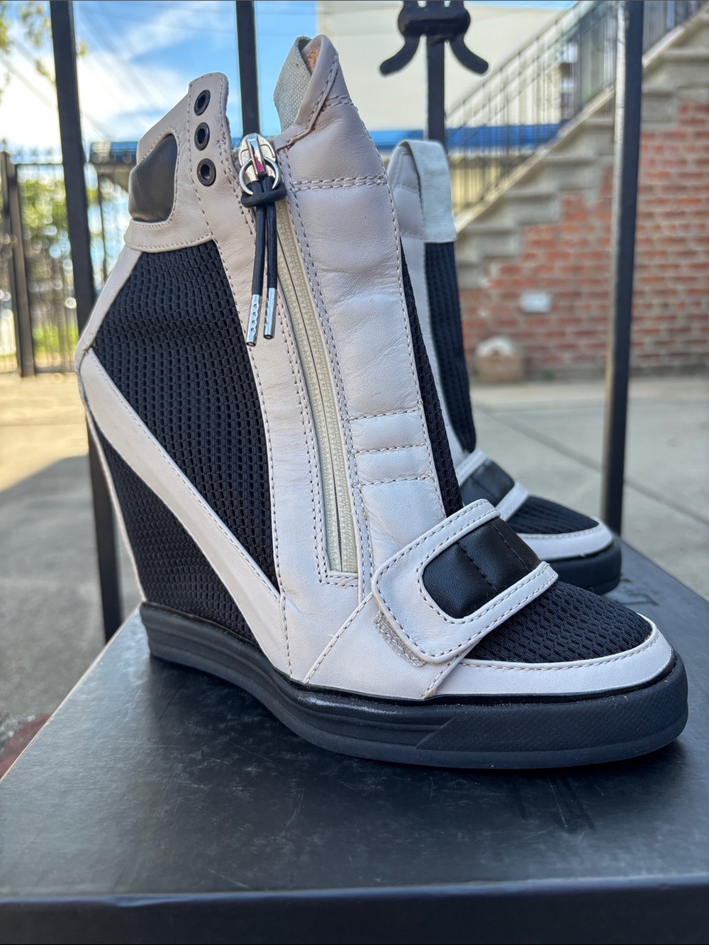 L.A.M.B. Black and Cream Wedge Sneaker Boots